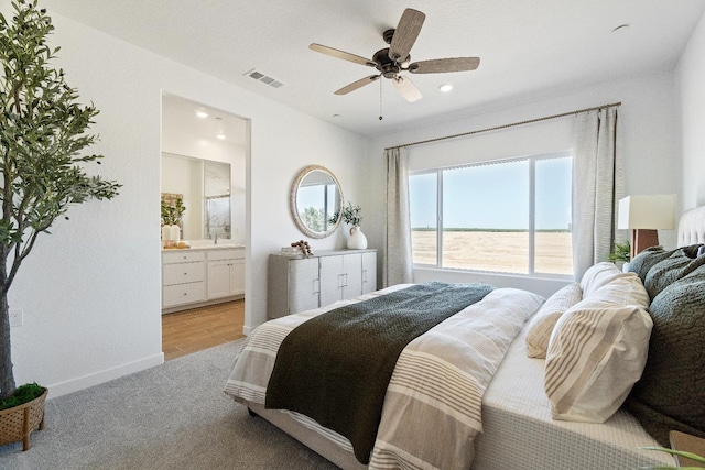 4433 N Phoenix, Fresno, CA 93723 - bedroom with light colored carpet, ensuite bath, a ceiling fan, and a sink