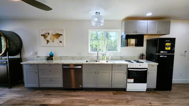 55062 Oak Crest Ct, Wishon, CA 93669 - kitchen with black appliances, a sink, gray cabinetry, dark wood-style floors, and light stone counters
