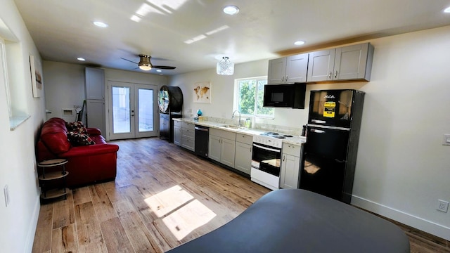 55062 Oak Crest Ct, Wishon, CA 93669 - kitchen with black appliances, plenty of natural light, light countertops, french doors, and recessed lighting