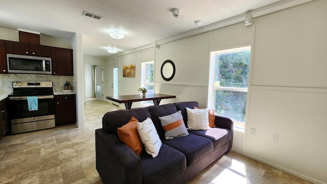 55062 Oak Crest Ct, Wishon, CA 93669 - living area with plenty of natural light and crown molding