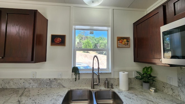 55062 Oak Crest Ct, Wishon, CA 93669 - kitchen featuring a sink, stainless steel microwave, and dark brown cabinetry