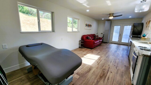 55062 Oak Crest Ct, Wishon, CA 93669 - sitting room featuring french doors, baseboards, wood finished floors, a ceiling fan, and recessed lighting