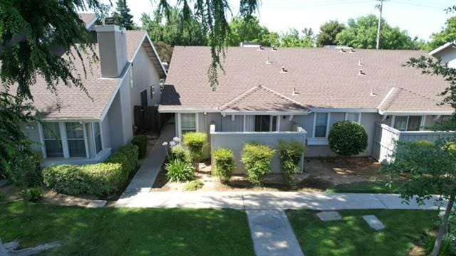 5455 N Marty Ave Unit 111, Fresno, CA 93711 - view of front of home featuring a chimney and stucco siding
