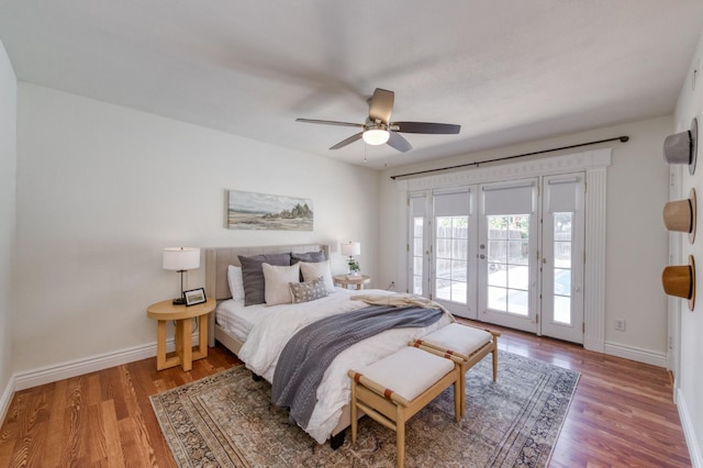 5753 N 7th St, Fresno, CA 93710 - bedroom featuring access to exterior, wood finished floors, baseboards, and french doors