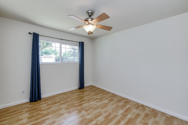 5753 N 7th St, Fresno, CA 93710 - empty room with light wood-style flooring, baseboards, and ceiling fan