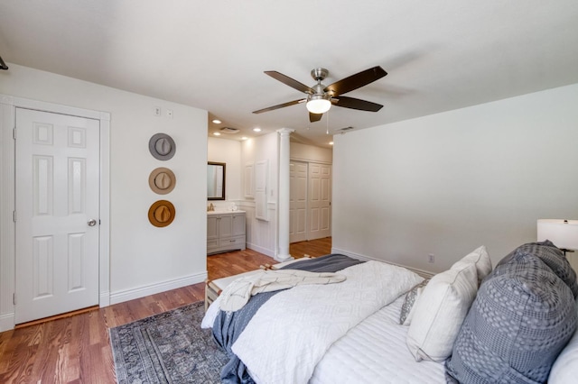 5753 N 7th St, Fresno, CA 93710 - bedroom featuring light wood finished floors, baseboards, decorative columns, recessed lighting, and ensuite bathroom