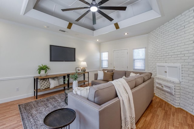 5753 N 7th St, Fresno, CA 93710 - living room with a raised ceiling, ceiling fan, light wood finished floors, brick wall, and recessed lighting
