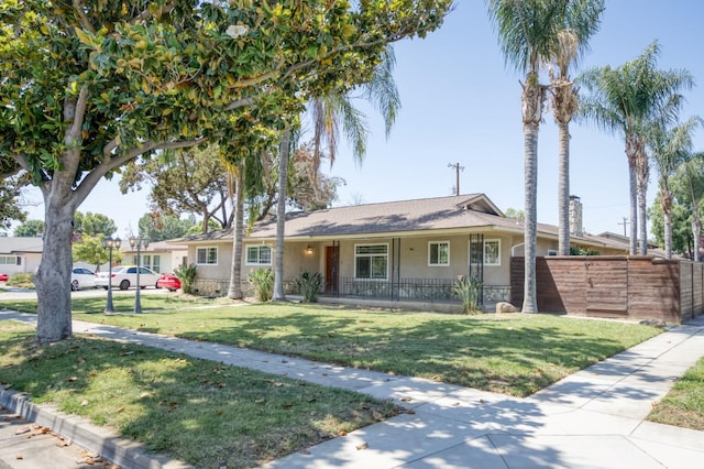 5753 N 7th St, Fresno, CA 93710 - view of front of property with stucco siding and covered porch
