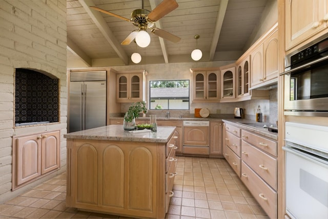 2331 W Celeste Ave, Fresno, CA 93711 - kitchen featuring dishwashing machine, built in refrigerator, light brown cabinetry, light tile patterned flooring, and a center island