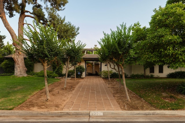2331 W Celeste Ave, Fresno, CA 93711 - view of property hidden behind natural elements featuring a front lawn