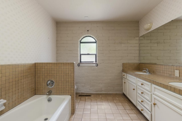 2331 W Celeste Ave, Fresno, CA 93711 - bathroom featuring wallpapered walls, double vanity, a garden tub, and tile patterned floors