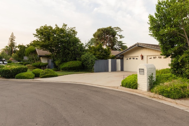 2331 W Celeste Ave, Fresno, CA 93711 - view of front of home with driveway and a garage