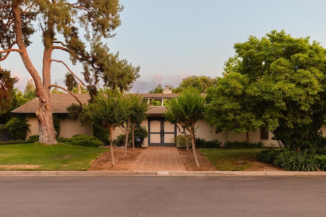 2331 W Celeste Ave, Fresno, CA 93711 - view of front of property with a front lawn, french doors, a chimney, and stucco siding