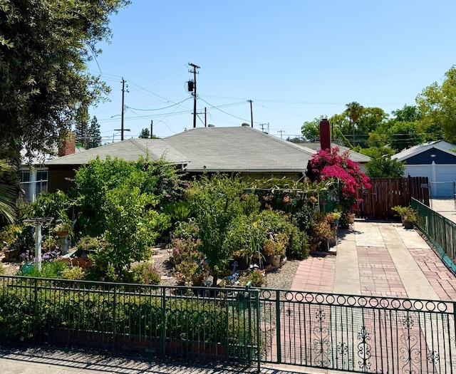 1584 N Carruth Ave, Fresno, CA 93728 - view of front of property with a patio area and a shingled roof