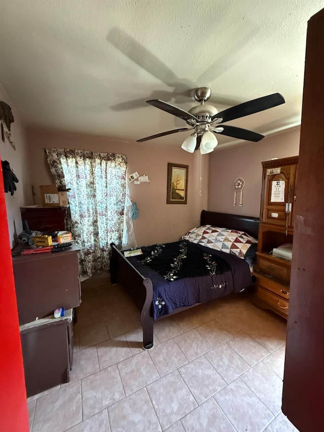 1584 N Carruth Ave, Fresno, CA 93728 - bedroom featuring light tile patterned floors, a textured ceiling, and ceiling fan