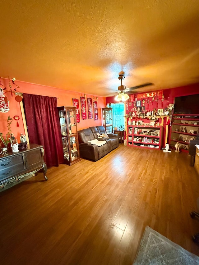 1584 N Carruth Ave, Fresno, CA 93728 - living area with wood finished floors, ceiling fan, and a textured ceiling