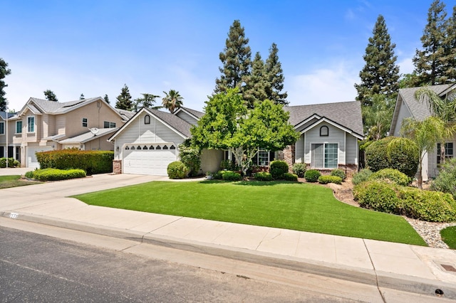 2173 Spruce, Clovis, CA 93611 - view of front of home featuring a garage, brick siding, concrete driveway, a front yard, and a residential view