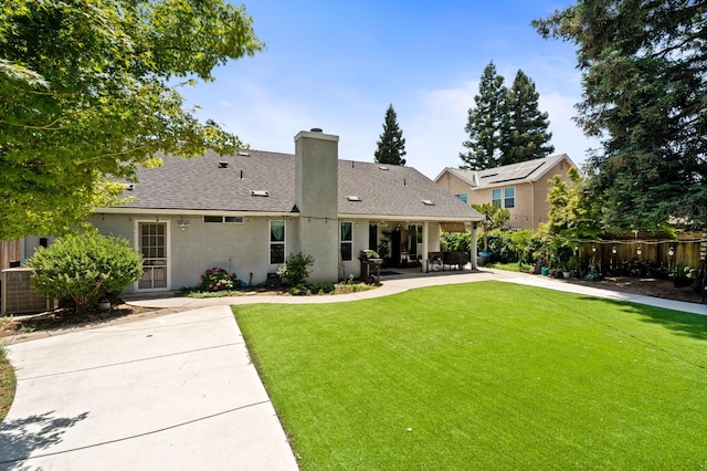 2173 Spruce, Clovis, CA 93611 - rear view of house featuring a patio, stucco siding, a chimney, a shingled roof, and central AC unit