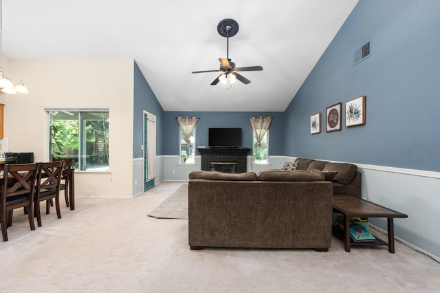 2173 Spruce, Clovis, CA 93611 - carpeted living room with a ceiling fan, lofted ceiling, baseboards, and a brick fireplace