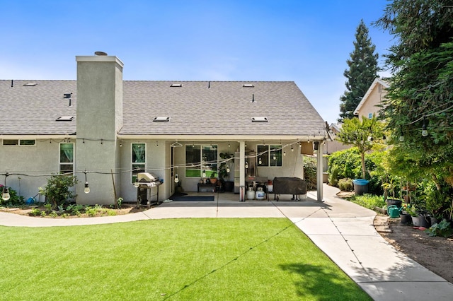 2173 Spruce, Clovis, CA 93611 - rear view of property with a patio, a shingled roof, a chimney, and stucco siding