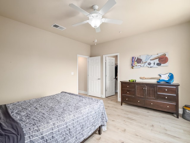 2127 Chennault Ave, Clovis, CA 93611 - bedroom featuring light wood-style flooring, a ceiling fan, baseboards, and a spacious closet