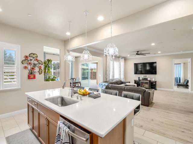 2127 Chennault Ave, Clovis, CA 93611 - kitchen with a sink, dishwasher, baseboards, recessed lighting, and hanging light fixtures