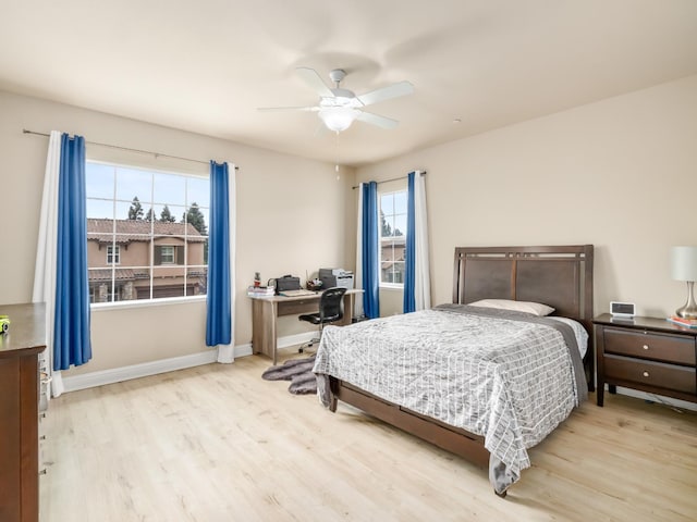 2127 Chennault Ave, Clovis, CA 93611 - bedroom with wood finished floors, an office area, baseboards, and a ceiling fan