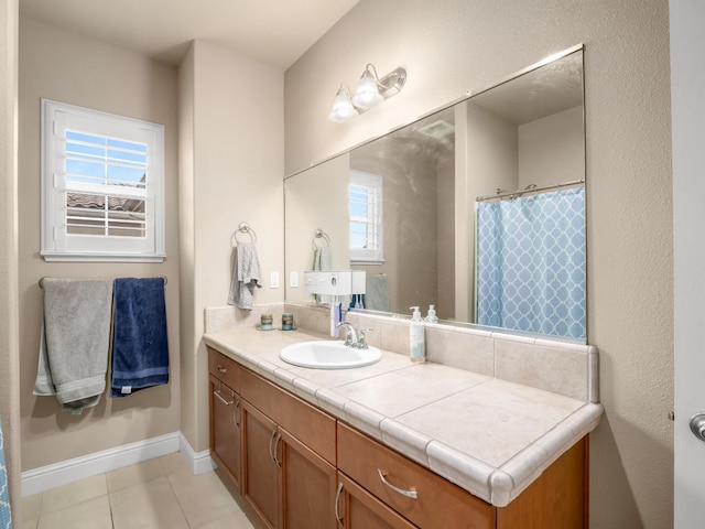 2127 Chennault Ave, Clovis, CA 93611 - bathroom with vanity, tile patterned floors, and baseboards