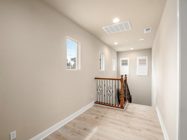 2127 Chennault Ave, Clovis, CA 93611 - hall with an upstairs landing, light wood-style floors, recessed lighting, and baseboards