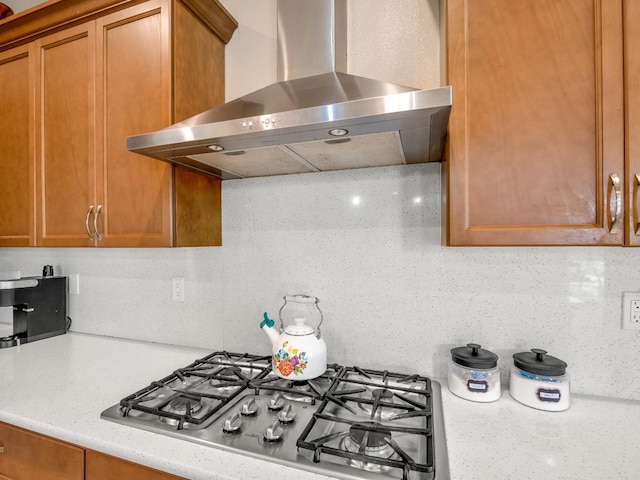 2127 Chennault Ave, Clovis, CA 93611 - kitchen with wall chimney exhaust hood, stainless steel gas stovetop, and brown cabinets