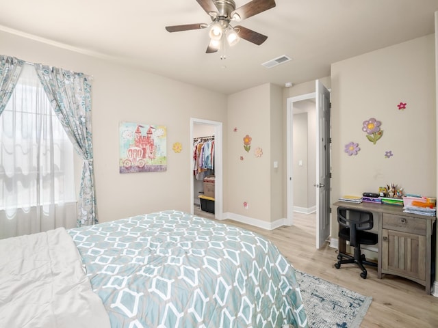 2127 Chennault Ave, Clovis, CA 93611 - bedroom with light wood-type flooring, a desk, baseboards, and a spacious closet