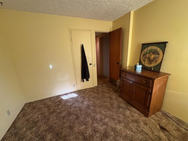 32101 E Trimmer Springs Rd, Sanger, CA 93657 - unfurnished bedroom with carpet floors and a textured ceiling