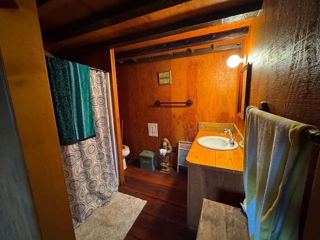 32101 E Trimmer Springs Rd, Sanger, CA 93657 - bathroom featuring vanity, wood walls, hardwood / wood-style floors, beamed ceiling, and curtained shower