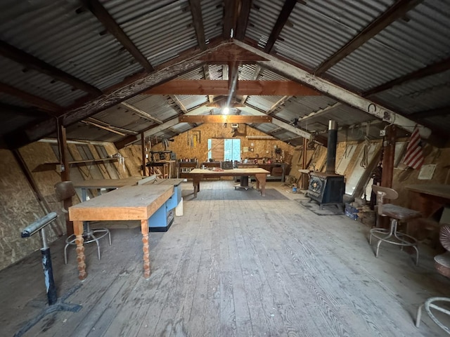 32101 E Trimmer Springs Rd, Sanger, CA 93657 - misc room featuring a workshop area, vaulted ceiling, wood-type flooring, and a wood stove