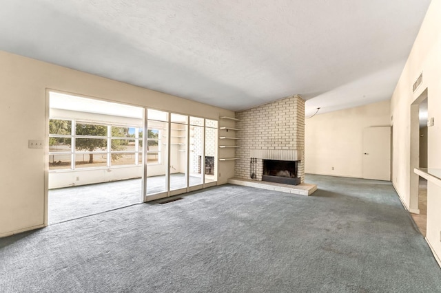 5495 E Atchison St, Fresno, CA 93727 - unfurnished living room with carpet floors, a fireplace, vaulted ceiling, and a textured ceiling