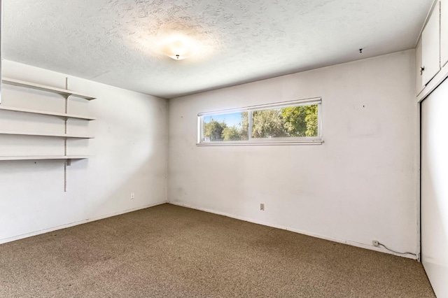 5495 E Atchison St, Fresno, CA 93727 - carpeted spare room featuring a textured ceiling