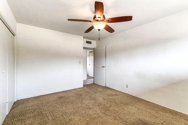 5495 E Atchison St, Fresno, CA 93727 - unfurnished bedroom featuring a closet, carpet floors, and ceiling fan