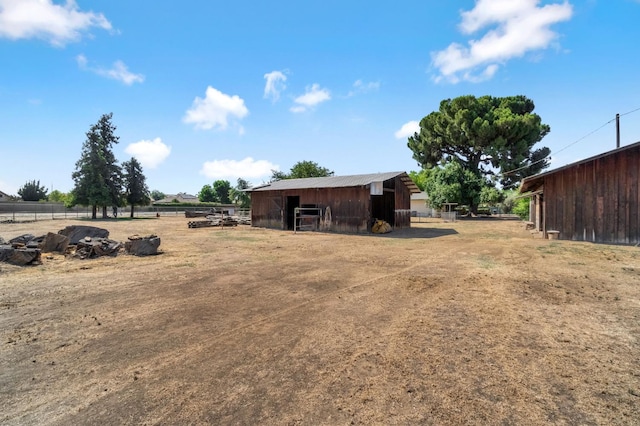 5495 E Atchison St, Fresno, CA 93727 - view of yard with an exterior structure and an outdoor structure