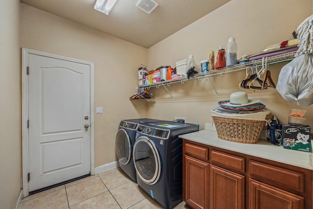 3615 W Sunnyview Ave NW, Visalia, CA 93291 - laundry room with washer and dryer, light tile patterned floors, baseboards, and cabinet space