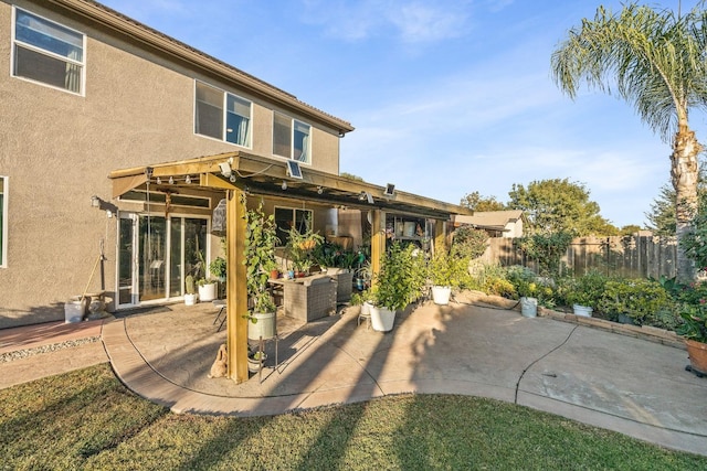 3615 W Sunnyview Ave NW, Visalia, CA 93291 - back of property featuring a patio area and stucco siding