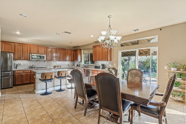 3615 W Sunnyview Ave NW, Visalia, CA 93291 - dining room featuring a chandelier, light tile patterned floors, and recessed lighting