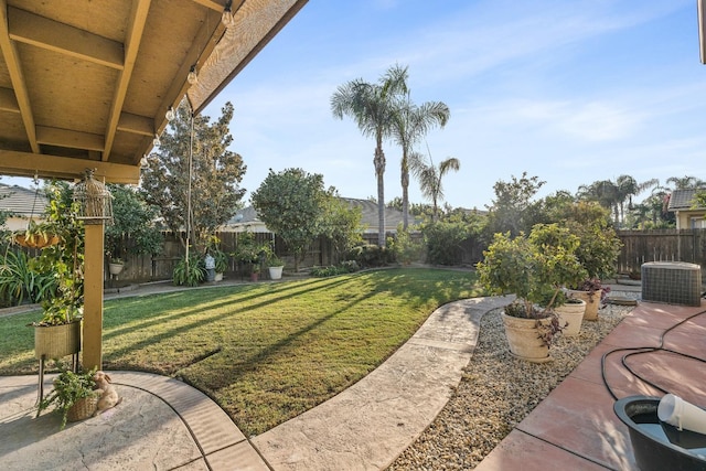 3615 W Sunnyview Ave NW, Visalia, CA 93291 - view of yard featuring central AC and a patio