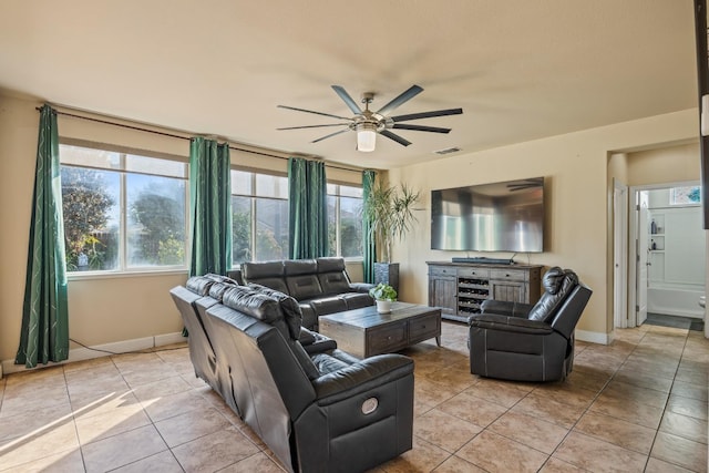 3615 W Sunnyview Ave NW, Visalia, CA 93291 - living room with ceiling fan, light tile patterned flooring, and baseboards