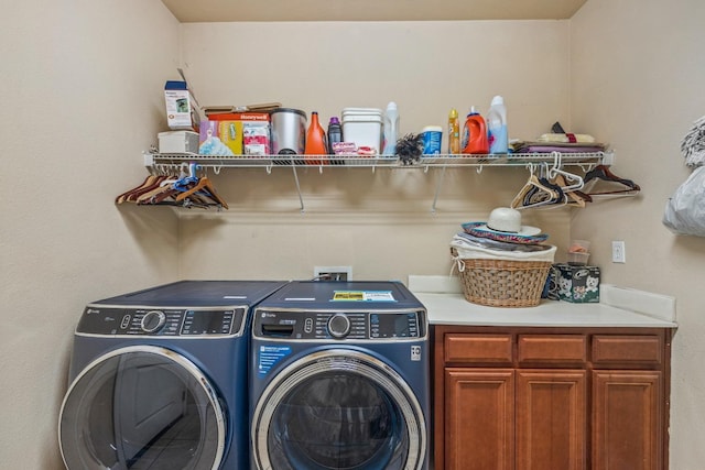 3615 W Sunnyview Ave NW, Visalia, CA 93291 - laundry room featuring washing machine and dryer and cabinet space