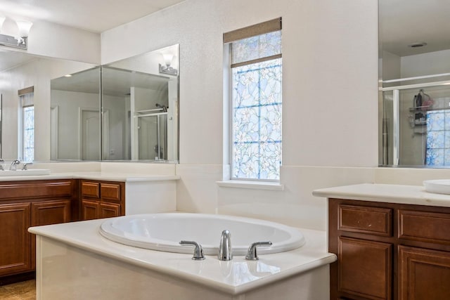 3615 W Sunnyview Ave NW, Visalia, CA 93291 - full bath featuring a shower stall, vanity, and a garden tub