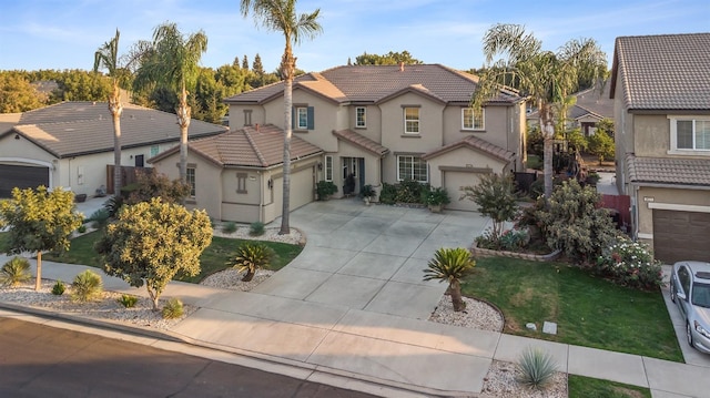 3615 W Sunnyview Ave NW, Visalia, CA 93291 - view of front of house featuring concrete driveway, stucco siding, a tile roof, and a garage