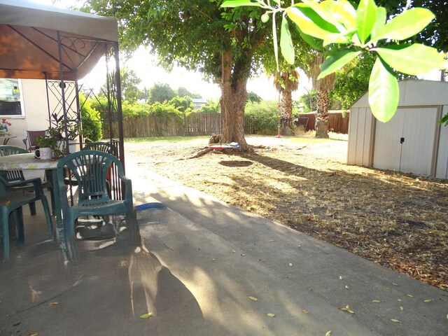 4457 E Brown Ave, Fresno, CA 93703 - view of yard featuring outdoor dining space and a patio area