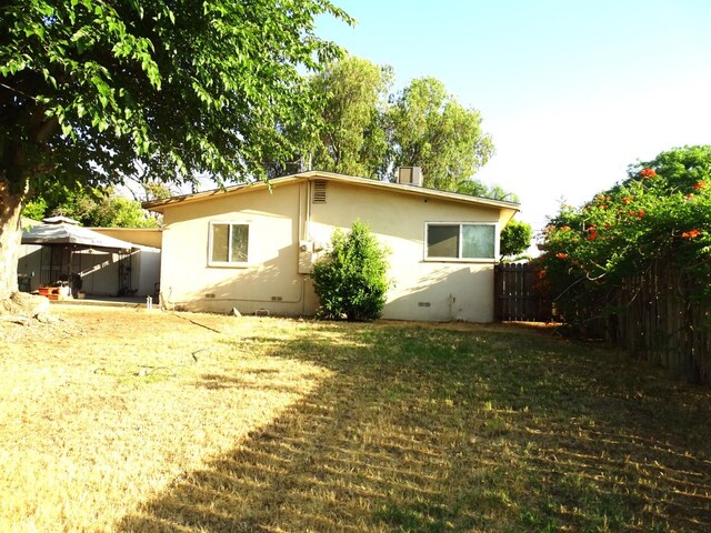 4457 E Brown Ave, Fresno, CA 93703 - back of property with a gazebo and stucco siding