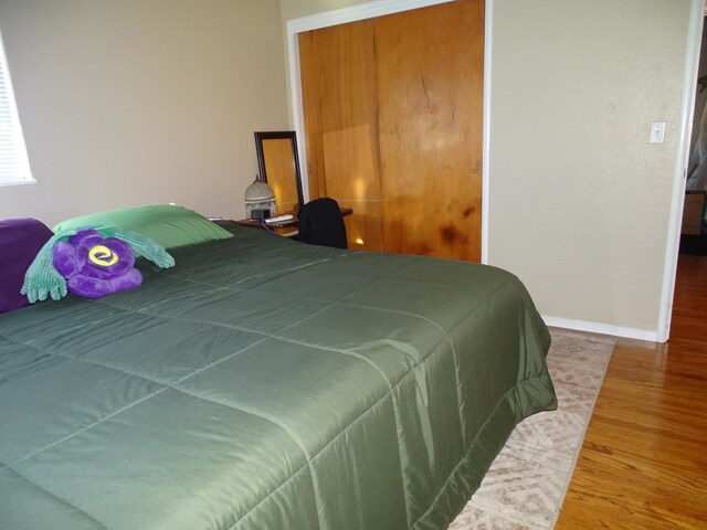 4457 E Brown Ave, Fresno, CA 93703 - bedroom featuring wood finished floors and baseboards