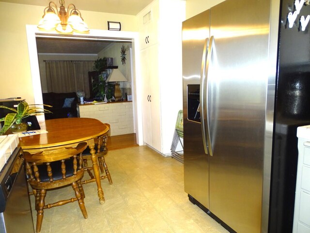 4457 E Brown Ave, Fresno, CA 93703 - dining area with light floors and a chandelier